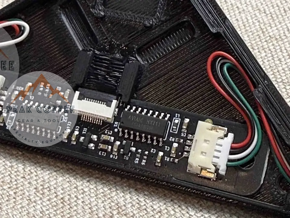 Gaggiuino scales converter hub board in its black enclosure